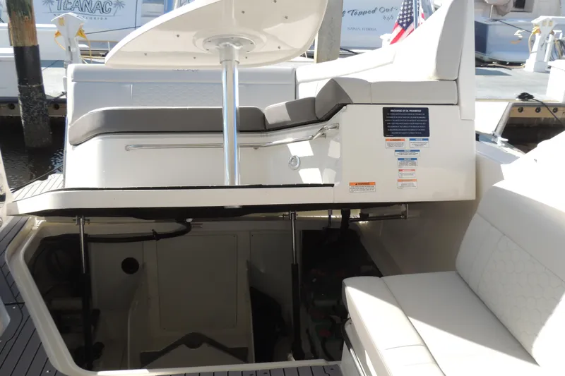 Slide: The Image of 2020 Sea Ray Sundancer 320 Outboard interior with seating and storage compartment. - 16