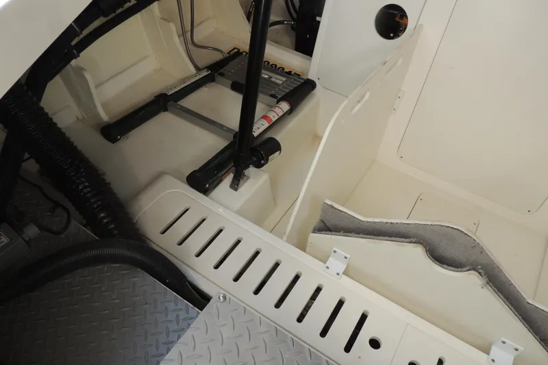 Slide: The Image of Interior view of 2020 Sea Ray Sundancer 320 Outboard, showcasing storage and mechanical components. - 18