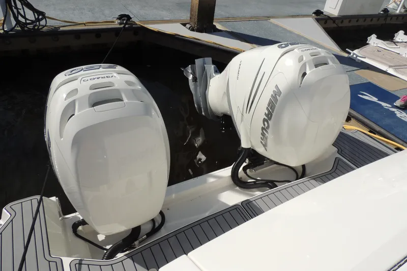 Slide: The Image of 2020 Sea Ray Sundancer 320 Outboard with twin Mercury engines docked at marina. - 28