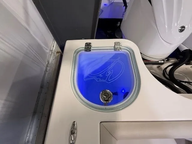 Slide: The Image of Sailfish 290 CC 2022 boat with blue-lit compartment. - 16