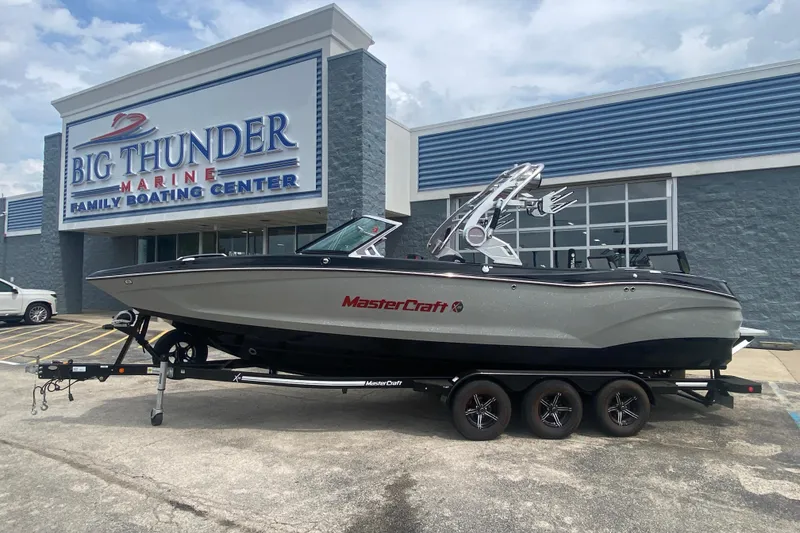 The Image of 2021 MasterCraft X26 boat on trailer at Big Thunder Marine dealership. - 1