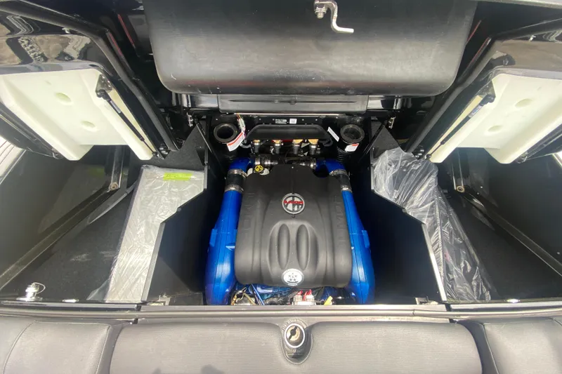 Slide: The Image of 2021 MasterCraft X26 engine compartment with blue accents and detailed components. - 12
