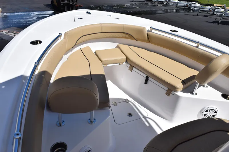 Slide: The Image of 2019 Sportsman Open 212 Center Console boat with tan seating and stainless steel railings. - 10
