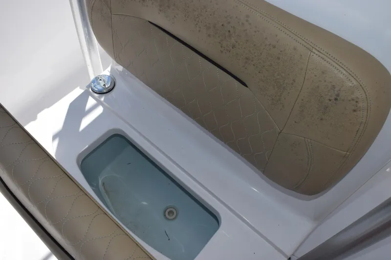 Slide: The Image of 2019 Sportsman Open 212 Center Console seat with storage compartment. - 12