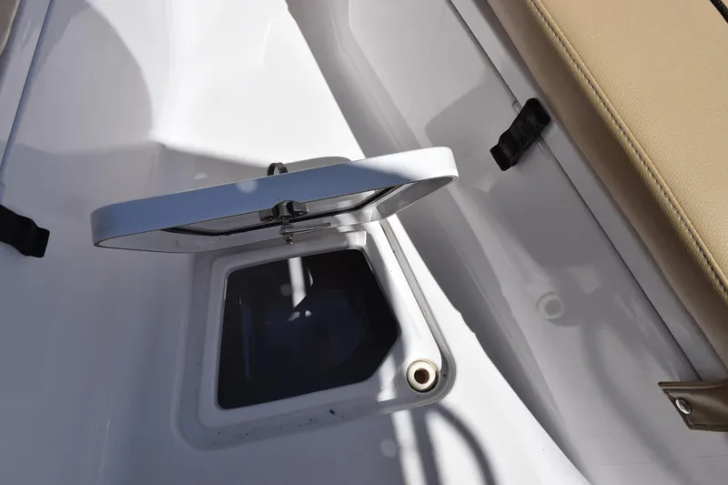 Slide: The Image of Open hatch on 2019 Sportsman Open 212 Center Console boat deck. - 14