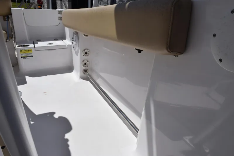 Slide: The Image of 2019 Sportsman Open 212 Center Console interior with cushioned seating and storage compartments. - 17
