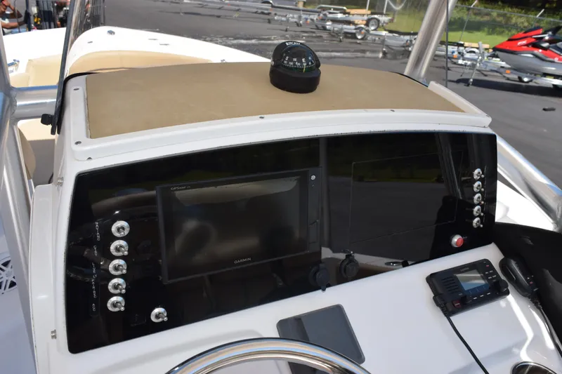Slide: The Image of 2019 Sportsman Open 212 Center Console dashboard with navigation equipment and controls. - 19