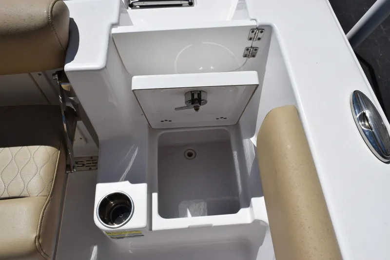 Slide: The Image of 2019 Sportsman Open 212 Center Console boat interior with sink and seating. - 20