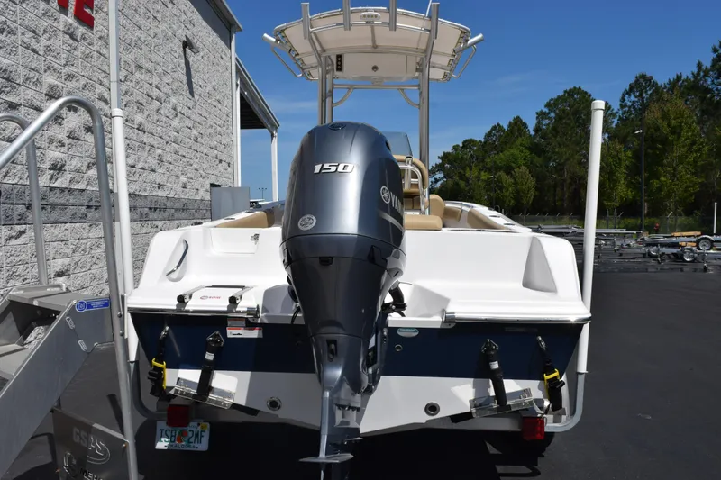 Slide: The Image of 2019 Sportsman Open 212 Center Console boat with Yamaha 150 engine, parked outdoors. - 4