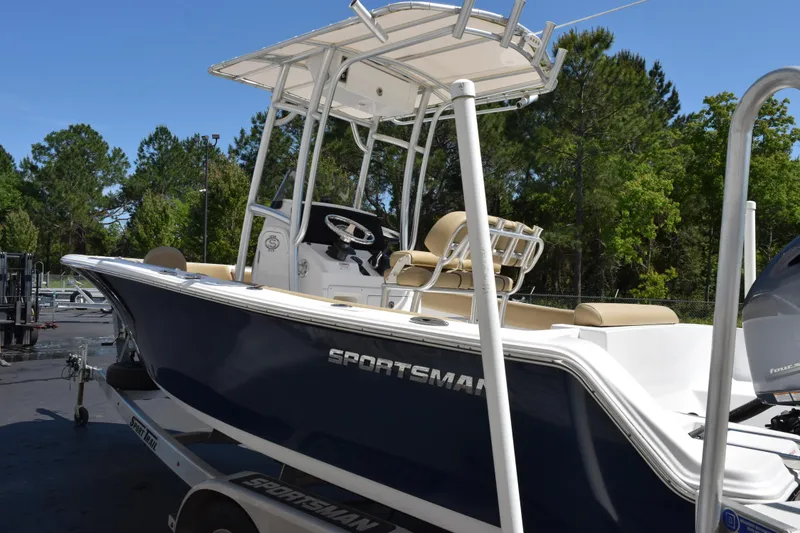 Slide: The Image of 2019 Sportsman Open 212 Center Console boat on trailer, featuring sleek design and spacious seating. - 5