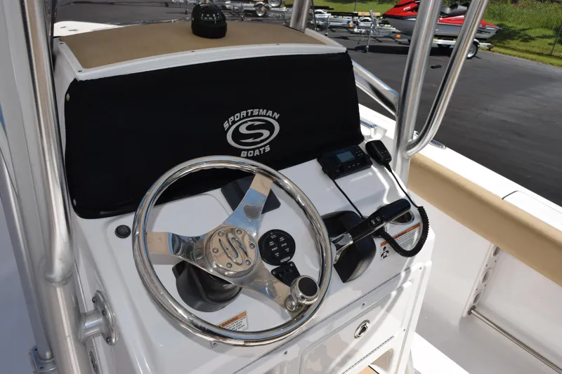 Slide: The Image of 2019 Sportsman Open 212 Center Console helm with steering wheel and controls. - 7