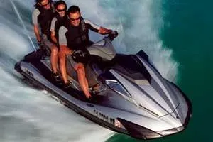 The Image of Three people riding a 2009 Yamaha WaveRunner FX SHO on the water. - 1