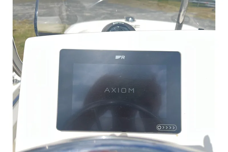 Slide: The Image of 2021 Boston Whaler 150 Montauk dashboard featuring Axiom display screen. - 14