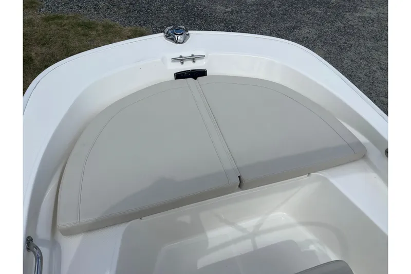Slide: The Image of 2021 Boston Whaler 150 Montauk boat bow seating area with cushions. - 6