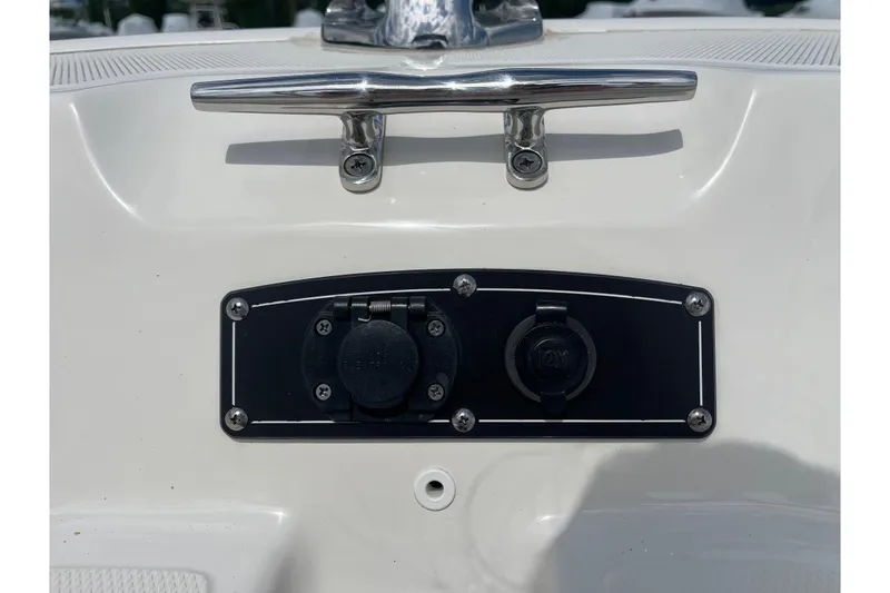 Slide: The Image of 2021 Boston Whaler 150 Montauk boat cleat and 12V power outlet. - 7