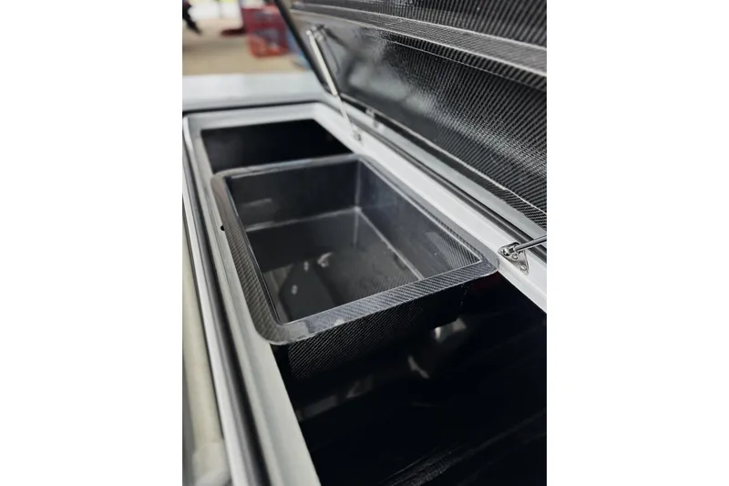 Slide: The Image of Open storage compartment of 2026 Chittum Skiffs 18 Challenger 2.0 boat. - 10