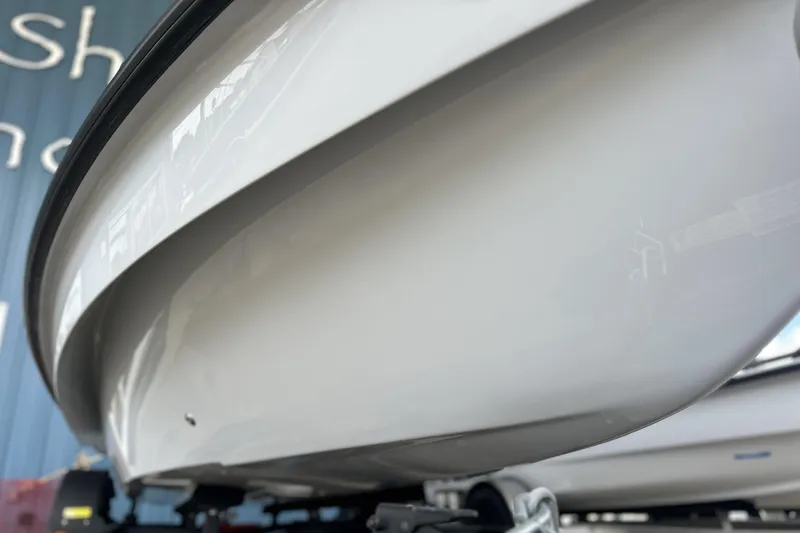 Slide: The Image of Close-up of 2026 Chittum Skiffs 18 Challenger 2.0 hull, showcasing sleek design and craftsmanship. - 12