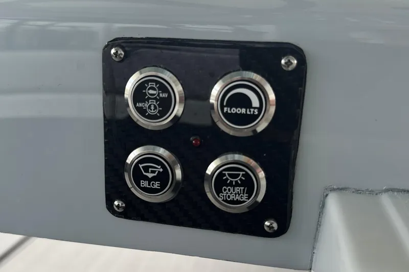 Slide: The Image of Control panel of 2026 Chittum Skiffs 18 Challenger 2.0 with labeled buttons. - 13