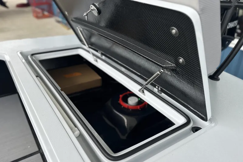 Slide: The Image of Open storage compartment on 2026 Chittum Skiffs 18 Challenger 2.0 boat. - 17
