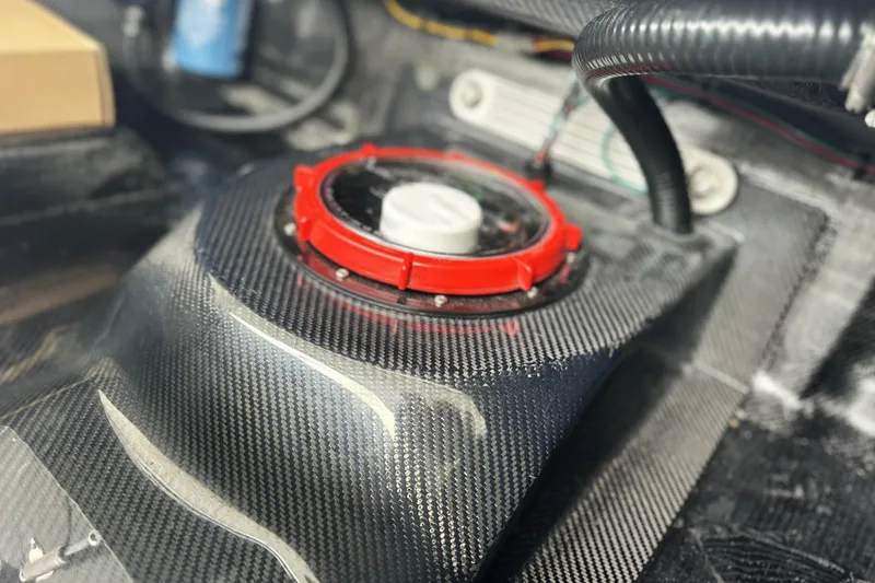 Slide: The Image of Carbon fiber detail of 2026 Chittum Skiffs 18 Challenger 2.0 interior component. - 18