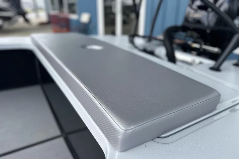 Slide: The Image of 2026 Chittum Skiffs 18 Challenger 2.0, gray cushioned seat detail. - 19