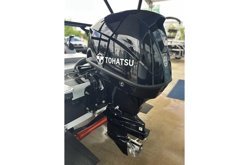 Slide: The Image of 2026 Chittum Skiffs 18 Challenger 2.0 with Tohatsu outboard motor, sleek and powerful design. - 2