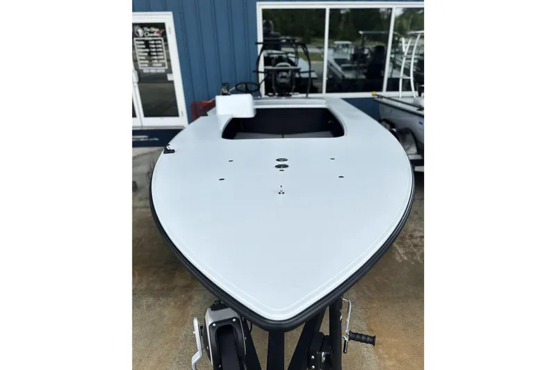 Slide: The Image of 2026 Chittum Skiffs 18 Challenger 2.0 boat displayed outdoors. - 26