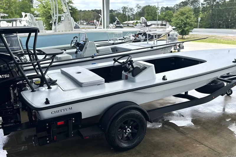 Slide: The Image of 2026 Chittum Skiffs 18 Challenger 2.0 boat on trailer, parked outdoors. - 28