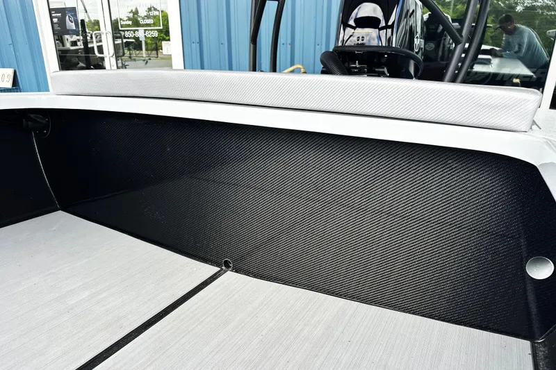 Slide: The Image of 2026 Chittum Skiffs 18 Challenger 2.0 interior with carbon fiber detailing and modern design. - 4