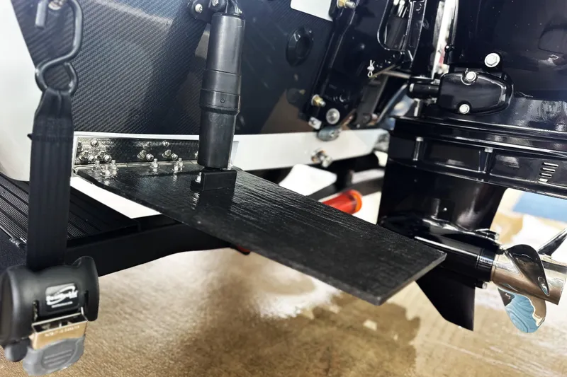 Slide: The Image of Close-up of 2026 Chittum Skiffs 18 Challenger 2.0 motor and trim tab. - 5