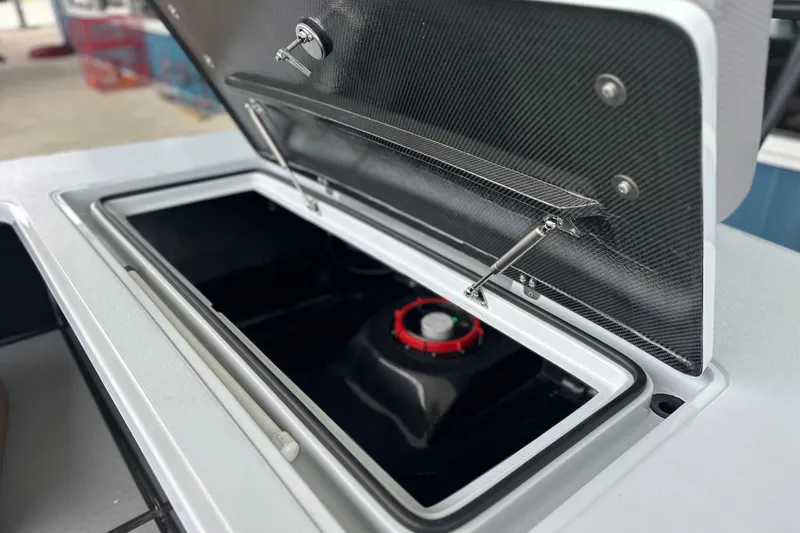 Slide: The Image of Open storage compartment of 2026 Chittum Skiffs 18 Challenger 2.0 boat. - 9