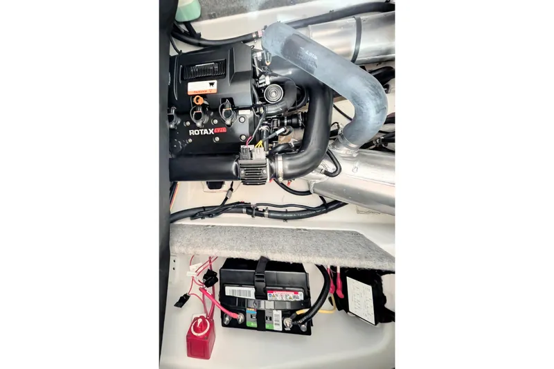 Slide: The Image of Engine compartment of 2023 Scarab 165 ID with Rotax 170 engine and battery setup. - 6