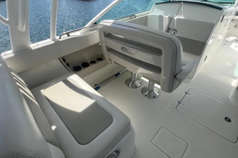 Slide: The Image of Interior of a 2015 Boston Whaler 320 Vantage boat with seating and cup holders. - 10