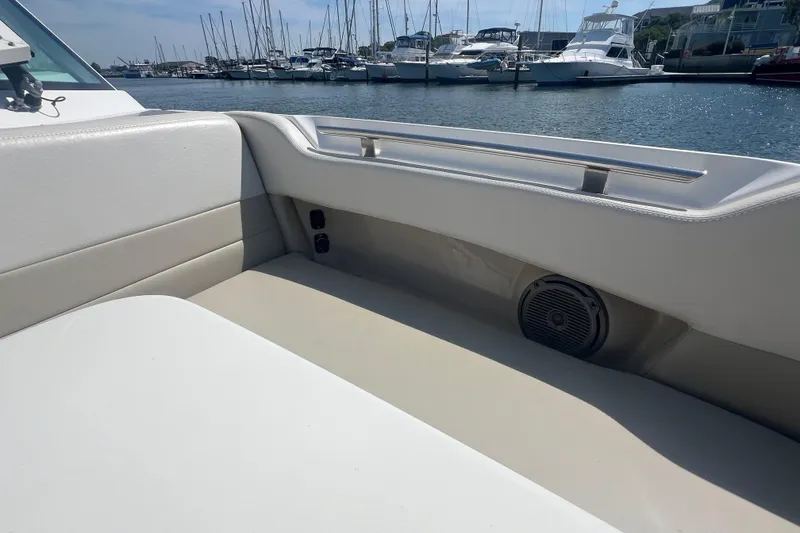 Slide: The Image of Interior view of a 2015 Boston Whaler 320 Vantage boat with marina background. - 21