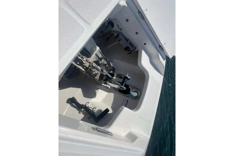 Slide: The Image of 2015 Boston Whaler 320 Vantage anchor compartment detail on water. - 22