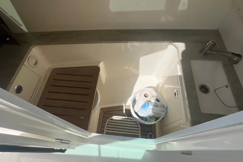 Slide: The Image of Interior view of 2015 Boston Whaler 320 Vantage boat sink area. - 27