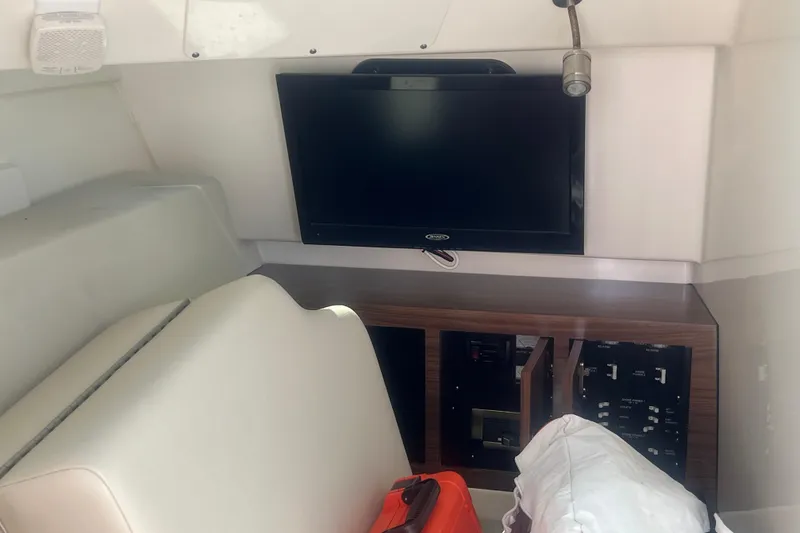 Slide: The Image of Interior of 2015 Boston Whaler 320 Vantage with TV and control panel. - 29