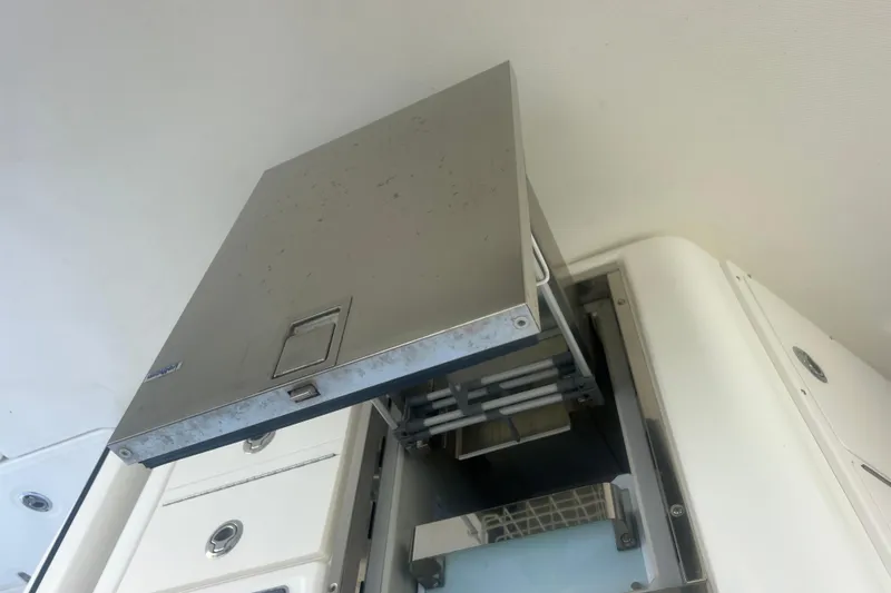 Slide: The Image of Stainless steel compartment on a 2015 Boston Whaler 320 Vantage boat. - 42