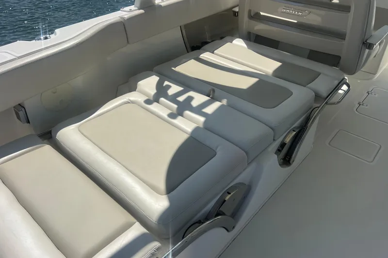 Slide: The Image of 2015 Boston Whaler 320 Vantage boat interior with comfortable seating and sleek design. - 44