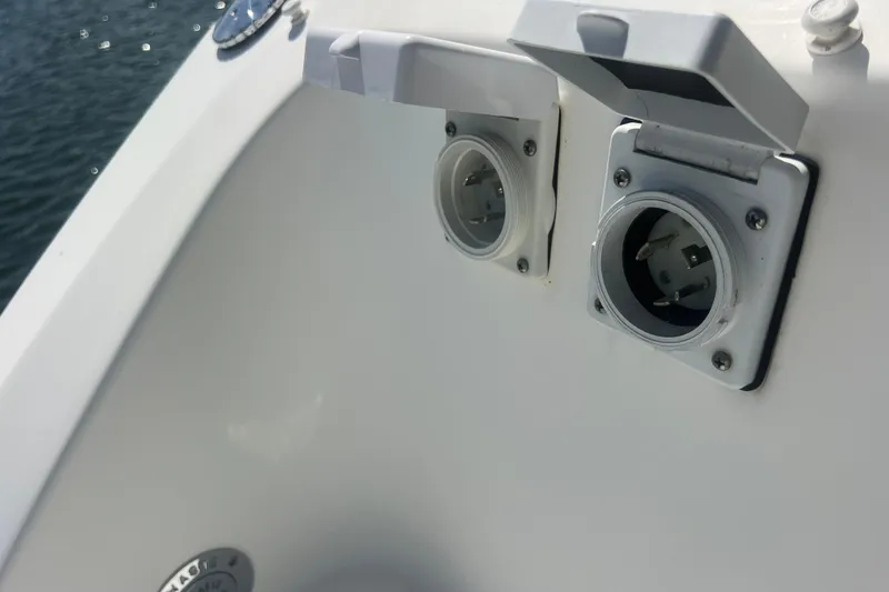 Slide: The Image of 2015 Boston Whaler 320 Vantage boat power outlets on deck. - 46