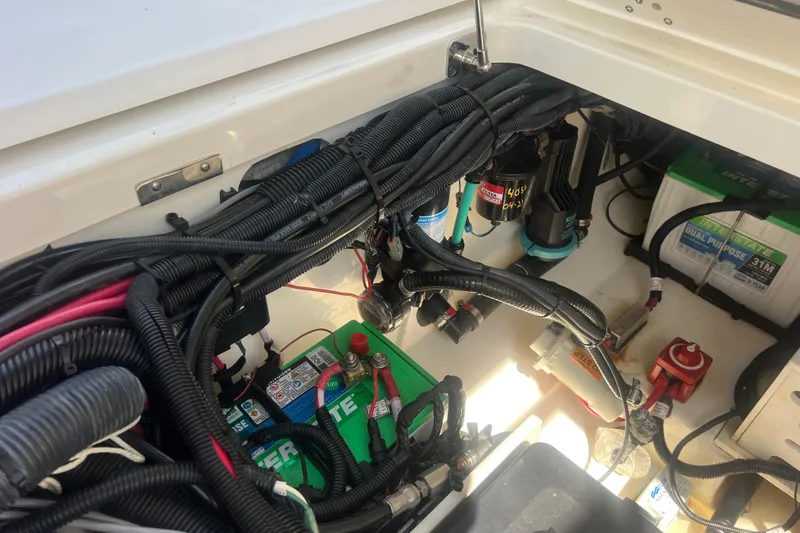 Slide: The Image of Electrical wiring and battery setup in a 2015 Boston Whaler 320 Vantage boat. - 51