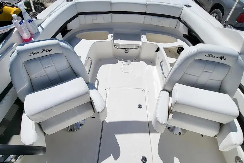 Slide: The Image of Interior of a 2016 Sea Ray SLX 250 boat with white seating and logo. - 7