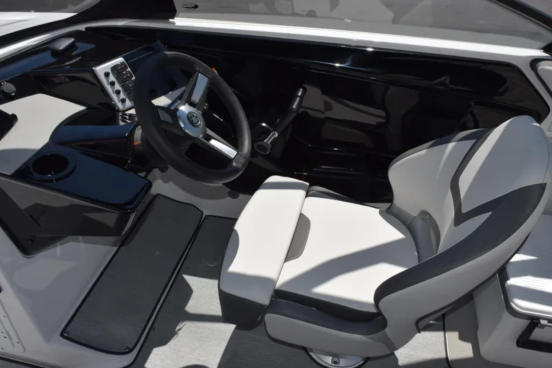 Slide: The Image of 2026 Yamaha Boats AR220 cockpit with sleek steering wheel and modern seating design. - 10