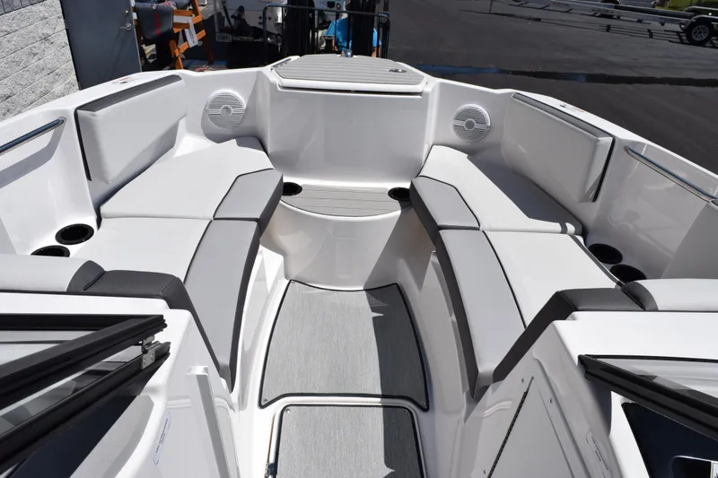 Slide: The Image of 2026 Yamaha Boats AR220 interior with spacious seating and modern design. - 12