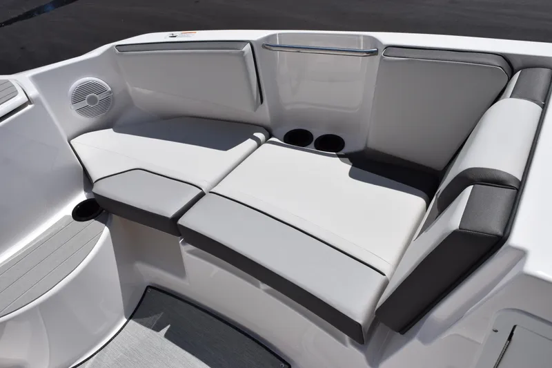 Slide: The Image of 2026 Yamaha Boats AR220 interior seating with cup holders and speaker. - 13