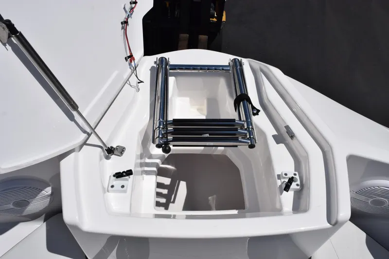 Slide: The Image of 2026 Yamaha Boats AR220 bow storage with ladder and speakers. - 15