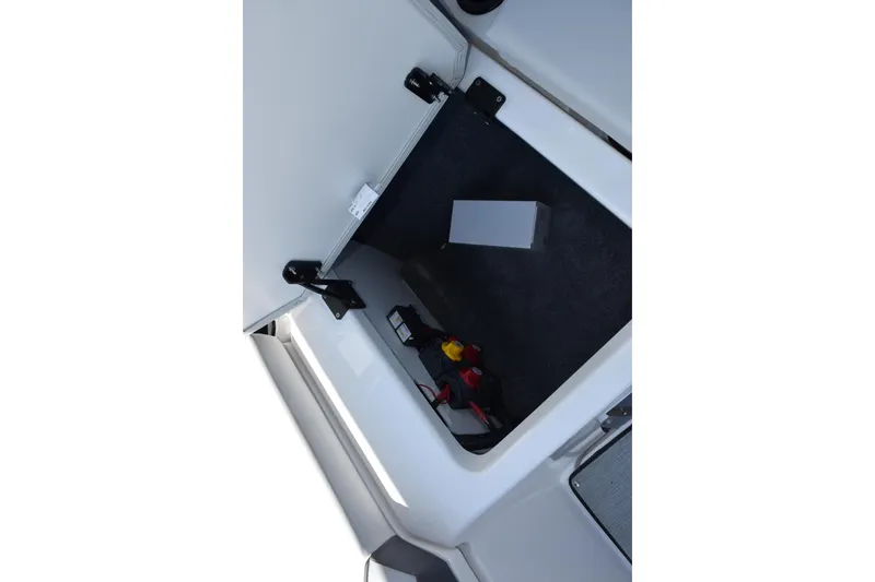 Slide: The Image of Storage compartment in 2026 Yamaha Boats AR220, showcasing interior space and utility features. - 23