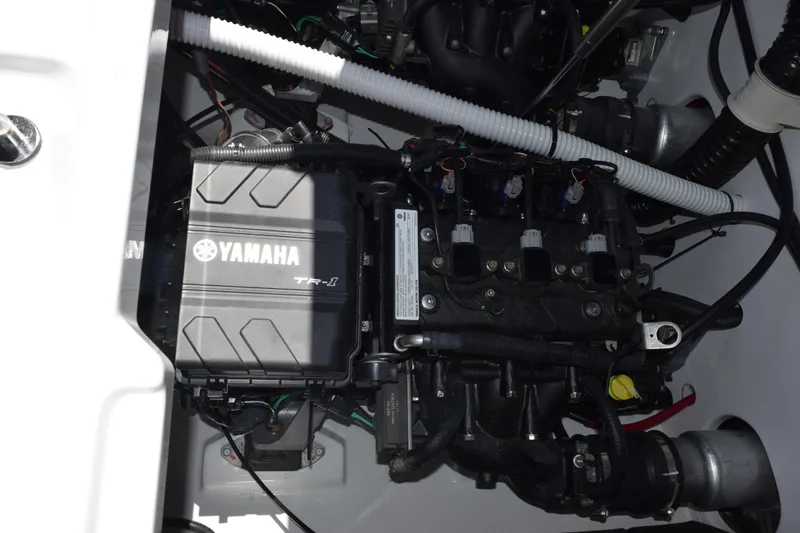 Slide: The Image of Engine compartment of 2026 Yamaha Boats AR220, showcasing Yamaha TR-1 engine components. - 25