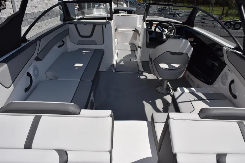 Slide: The Image of 2026 Yamaha Boats AR220 interior with sleek seating and modern helm design. - 7