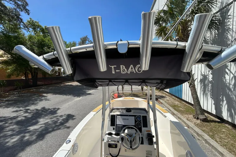 Slide: The Image of 2018 Robalo R180 Center Console boat with T-top and rod holders. - 14